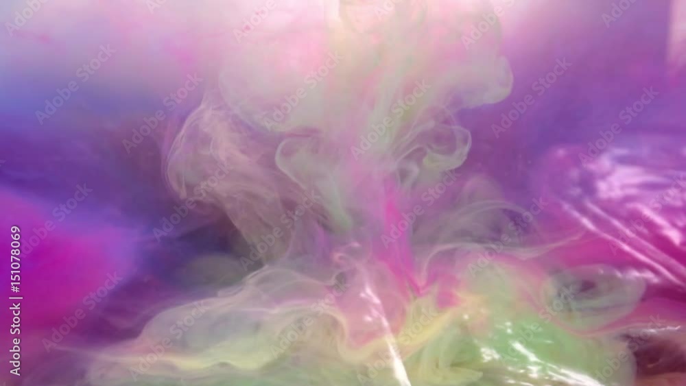 Different colors of ink in water abstract background texture slow motion Different colors of ink in water abstract background texture slow motion