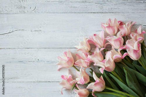 Fototapeta Naklejka Na Ścianę i Meble -  Pink tulips on a wooden background