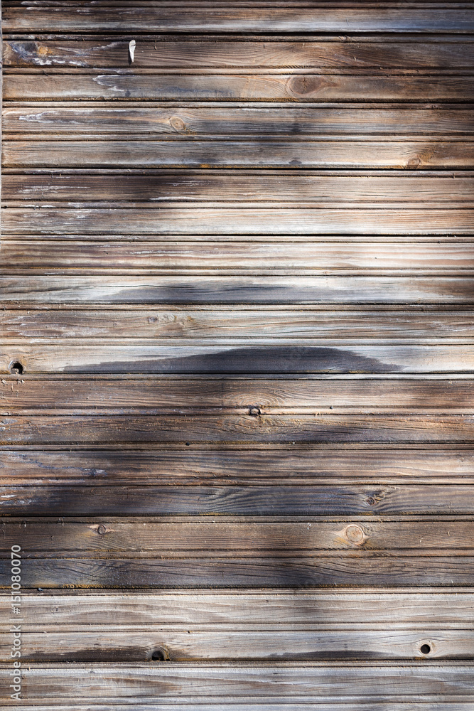 Fototapeta premium wooden house wall with shadows in the sun
