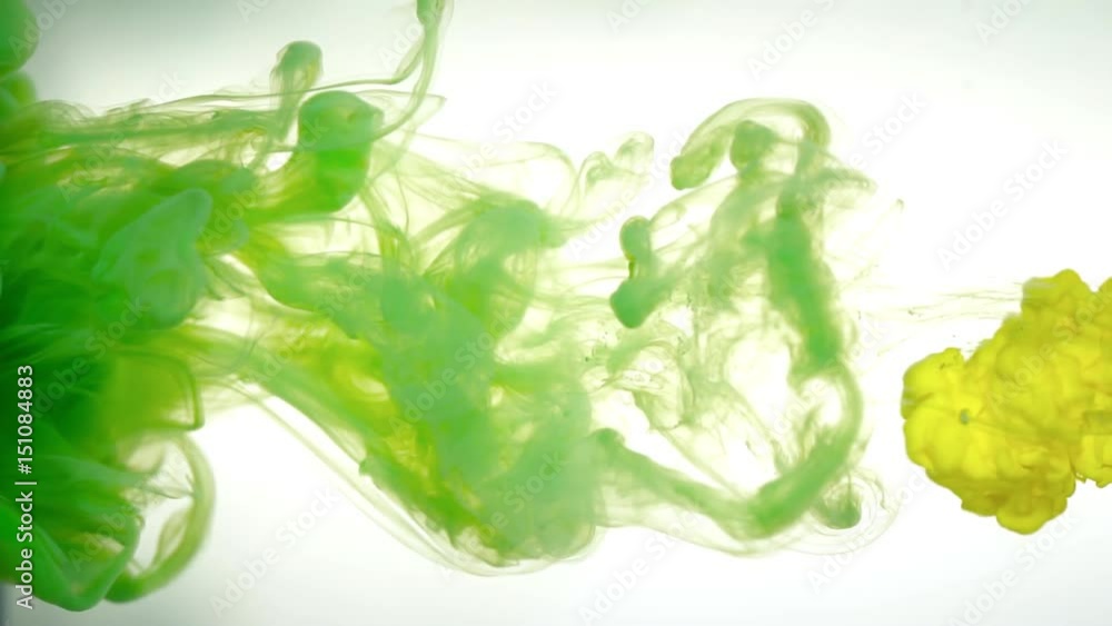 Yellow ink in green water abstract background texture slow motion Yellow ink in green water abstract background texture slow motion