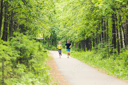 Wallpaper Mural Running together - friends jogging in park Torontodigital.ca