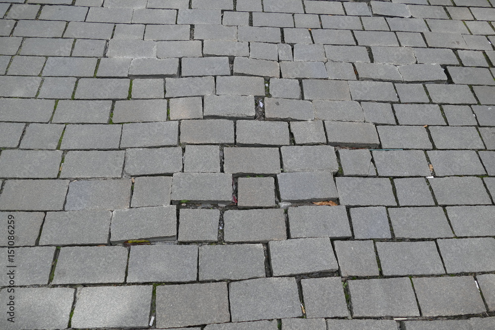 broken pattern of street cobble pavement broken pattern of street cobble pavement