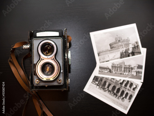 Old biooptic camera and old black and white pics photo