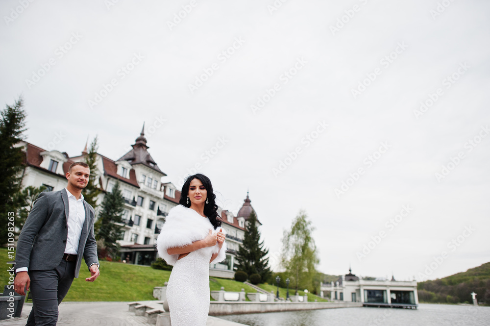 Young fashionable lovely couple at wedding anniversary and marriage proposal day against royal palace. Young fashionable lovely couple at wedding anniversary and marriage proposal day against royal palace.