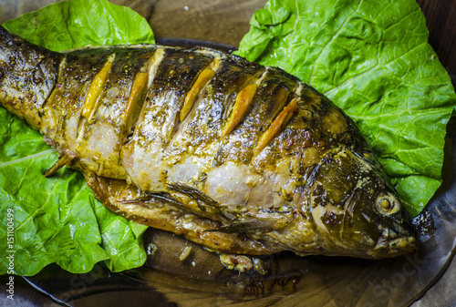 Baked carp with lemon