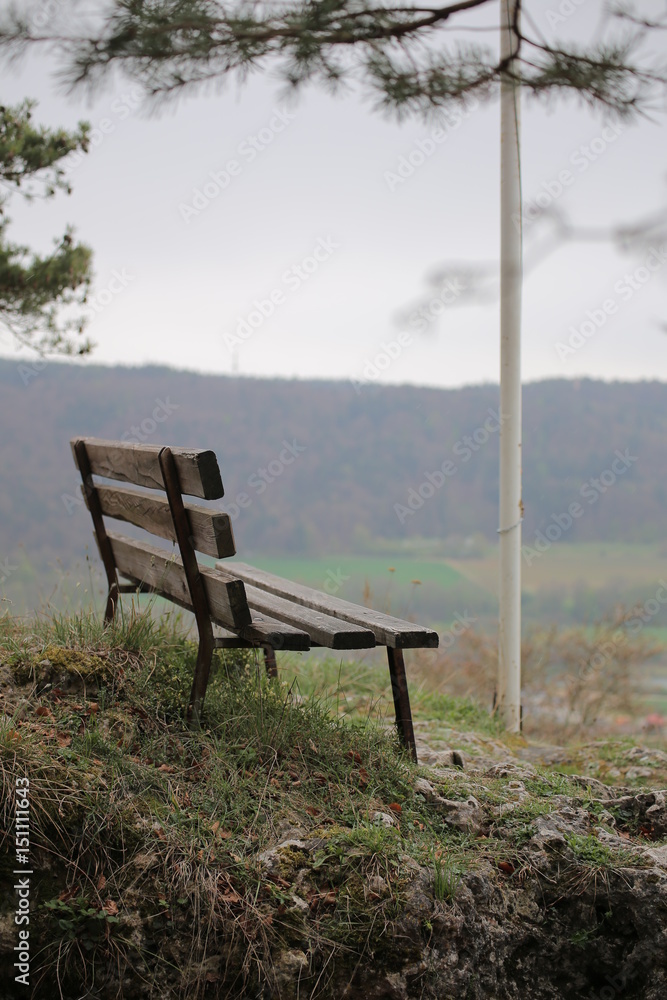 Bench on Wolfsberg in Germany with defocused background Bench on Wolfsberg in Germany with defocused background