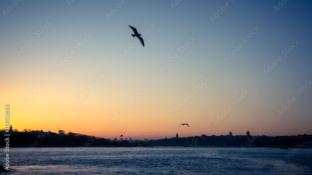Istanbul, Turkey - April 10 2015: Sunset over Bosphorus in Istanbul cityscape
