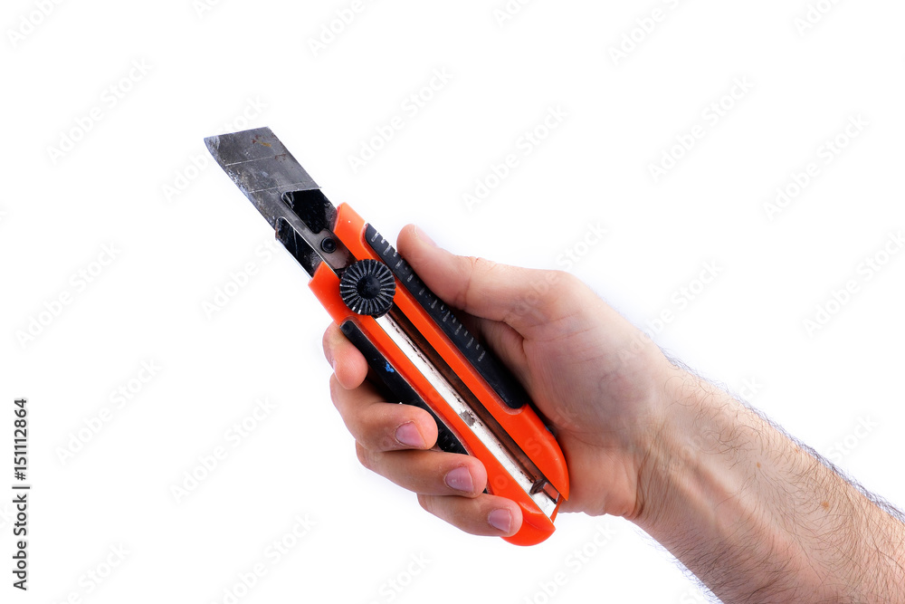man's hand hold used paper knife with black and red handle isolated on white background man's hand hold used paper knife with black and red handle isolated on white background