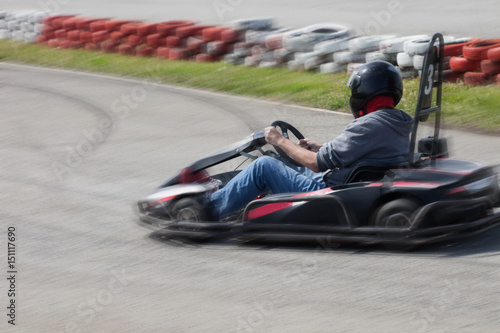 man drive go kart on track back view © Coka