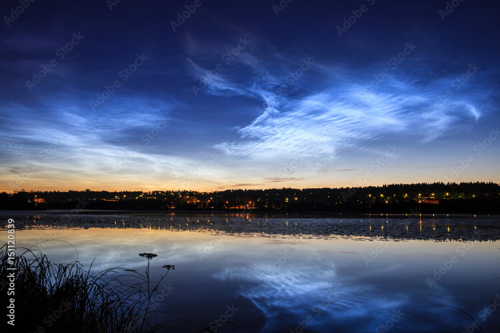 Noctilucent clouds at night sky