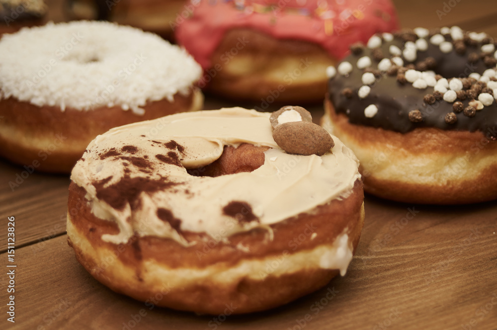 donuts on a wooden table donuts on a wooden table