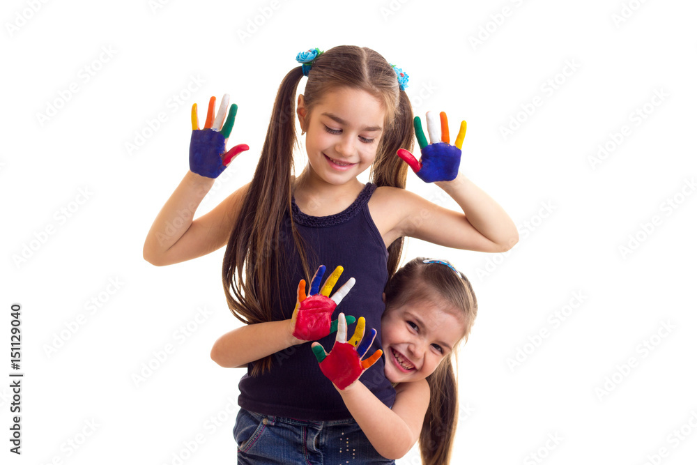 Little girls with colored hands Little girls with colored hands