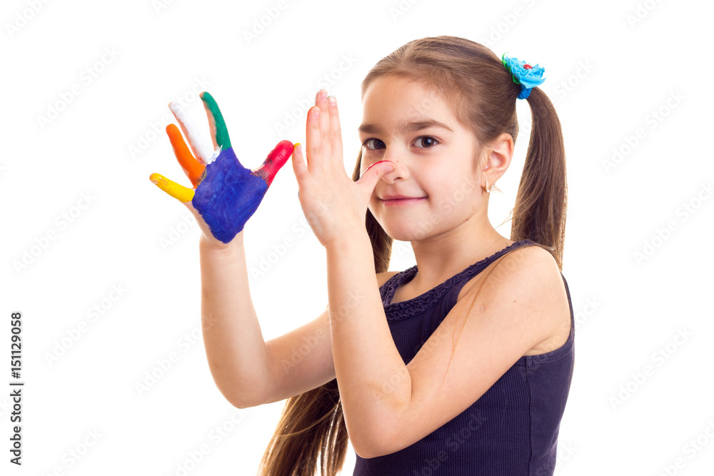 Little girl with colored hands Little girl with colored hands