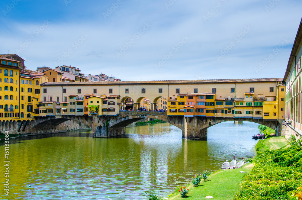 Ponte Vecchio, Old Bridge, medieval stone arch bridge over the Arno River and with many small shops along it, Florence, Tuscany, Italy, Europe. UNESCO World Heritage Site