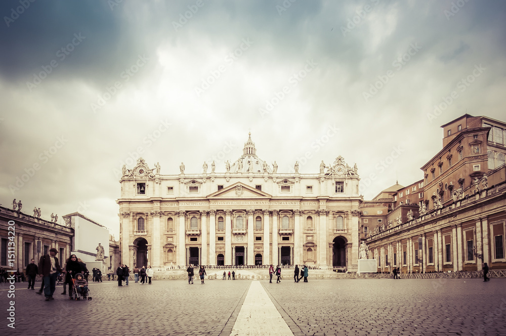 VATICAN CITY, ROME, ITALY - NOV 28, 2011: St. Peter's square in the cloudy dramatic day. St. Peter's Square is a large plaza located directly in front of St. Peter's Basilica in the Vatican City