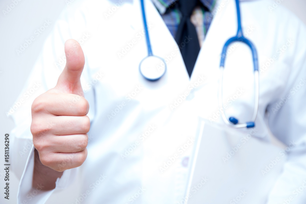close up of male doctor hand showing thumbs up. close up of male doctor hand showing thumbs up.