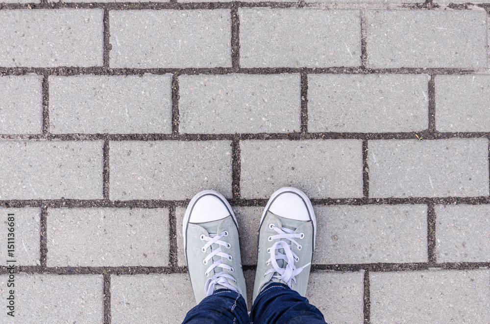 Background, legs on a background texture of a brick wall, white color on the whole frame. Horizontal frame Background, legs on a background texture of a brick wall, white color on the whole frame. Horizontal frame