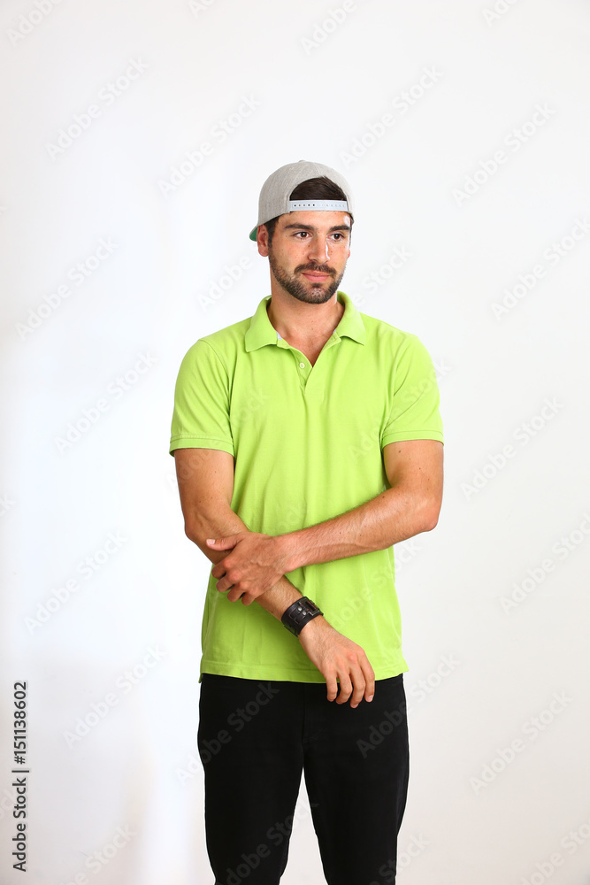 Young man is posing in a Studio