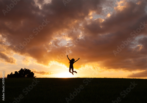 Happy woman jumping for joy.