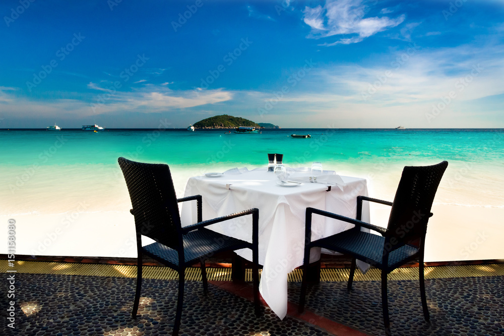 Outdoor dinning table by the beautiful Sea setting for 2 people.
