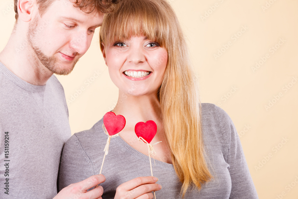 Lovely happy couple with hearts. Lovely happy couple with hearts.