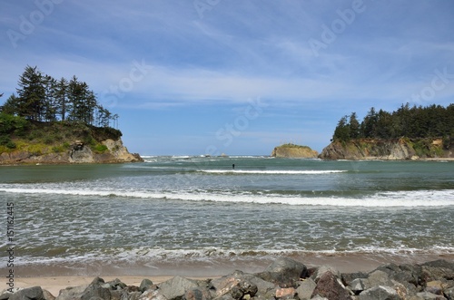 Paddle Boarder In Sunset Bay State Park, Oregon photo