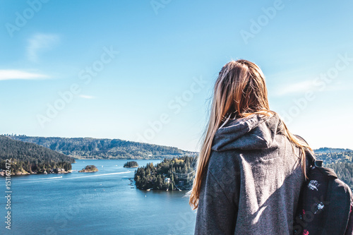 Fototapeta Naklejka Na Ścianę i Meble -  Backpacker Girl on top of Quarry Rock at North Vancouver, BC, Canada