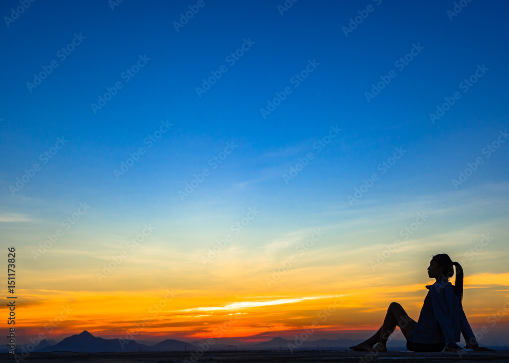 woman with sunset silhouette