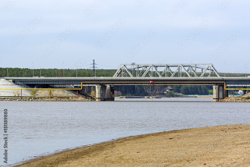 Obraz premium View from river on bridge and the Federal highway M-52. The river Berd, Berdsk, Novosibirsk oblast Siberia, Russia