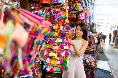 Woman enjoy shopping in weekend market photo