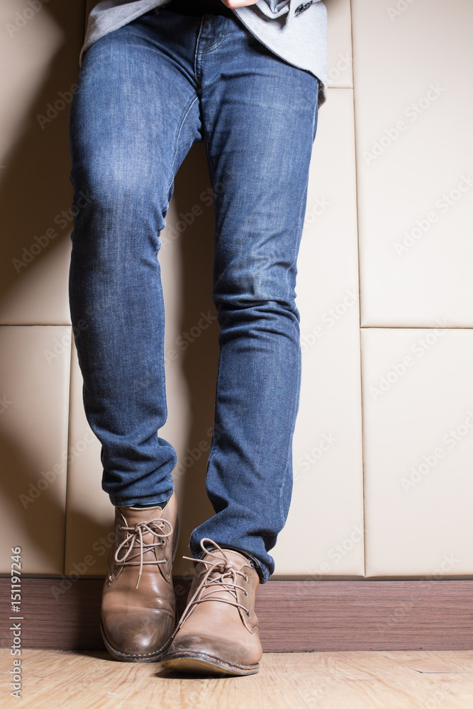 Young fashion man with jeans and boot in businness concept Young fashion man with jeans and boot in businness concept
