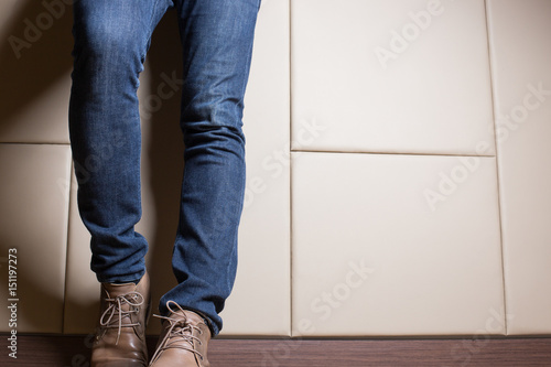 Young  fashion man with jeans and boot in businness concept photo