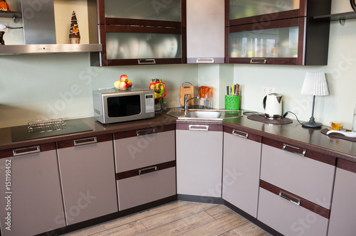 Modern kitchen interior made in brown tones