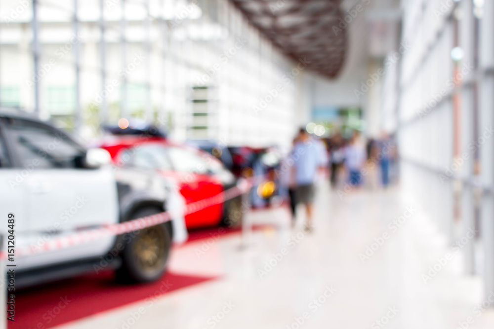 blurred visitors at motor show blurred visitors at motor show