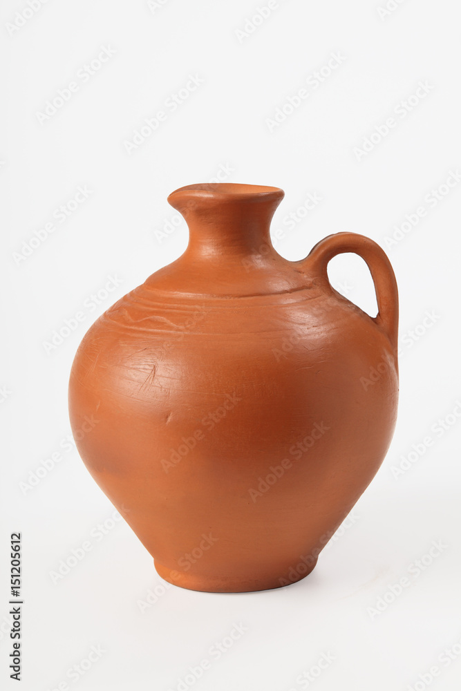 Ceramic jug for olive oil and grape wine on a white background. Isolated. Close-up