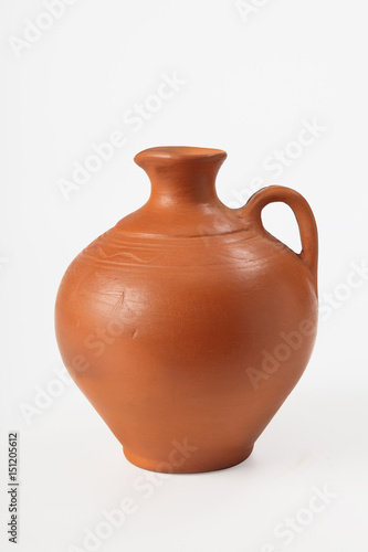Ceramic jug for olive oil and grape wine on a white background. Isolated. Close-up