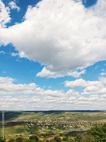 Clouds and blue sky above rural landscape