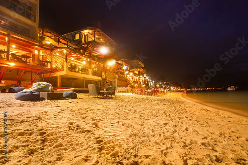 Tourists enjoy Chaweng Beach nightlife at Koh Samui beachside restaurant & bar - Thailand