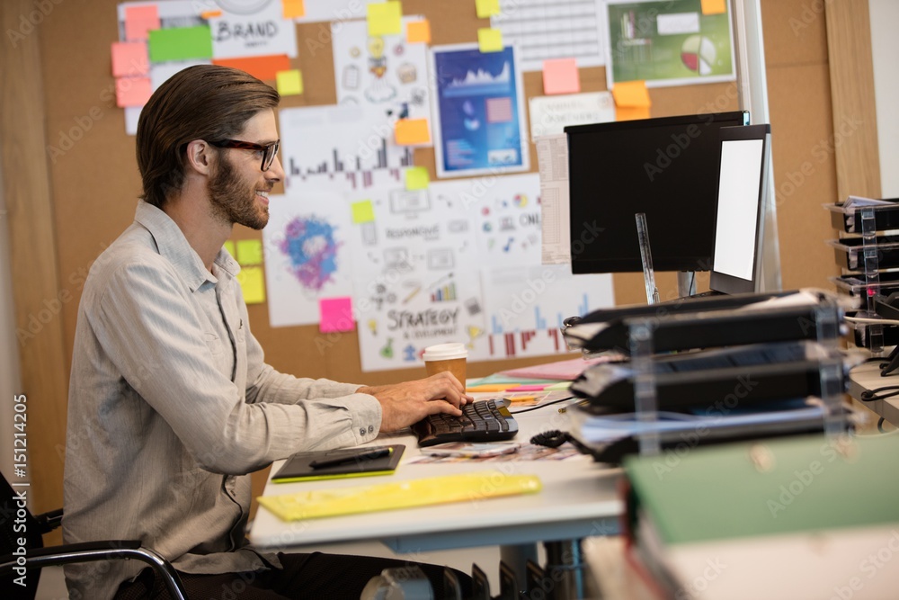 Businessman working at desk in office Businessman working at desk in office