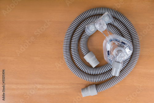 Pair of CPAP mask and tubing..Cleaning cpap mask and tubing is a routine job,flat lay..