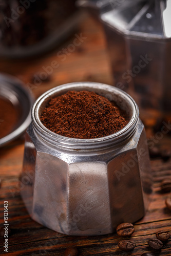 Old coffee maker filled with ground coffee