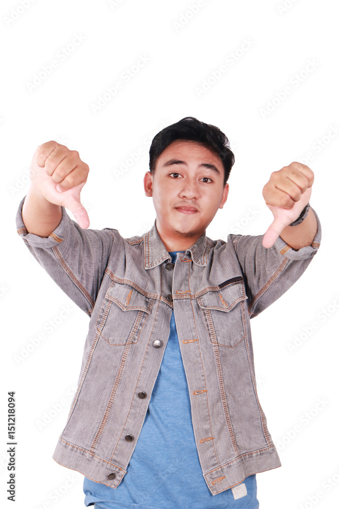 Young Asian Guy Mocking Gesture with Thumbs Down Young Asian Guy Mocking Gesture with Thumbs Down