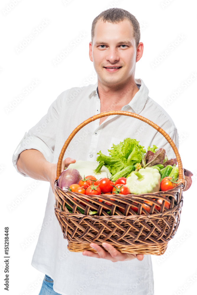 Farmer with a basket full of vegetables on a white background Farmer with a basket full of vegetables on a white background