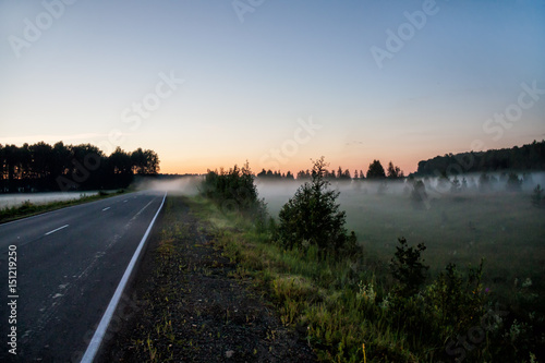 Ground fog near the road at sunset