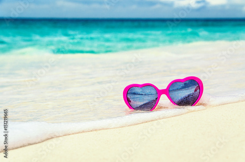 Sunglasses heart on the seashore