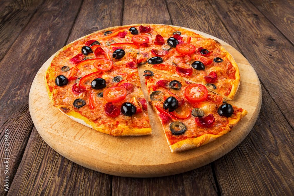 Delicious pizza with salami, mushrooms and olives