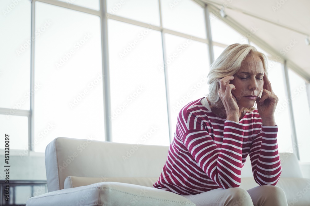 Fototapeta premium Tensed entrepreneur sitting on sofa
