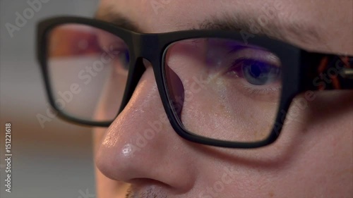 Wallpaper Mural Close up shot of male caucasian face with eyeglasses. Man works on computer and computer screen reflects in his glasses. Torontodigital.ca