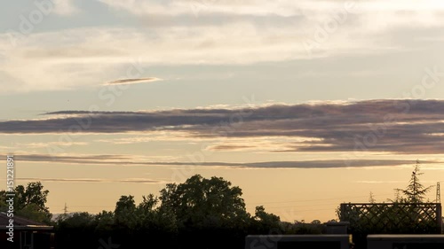 4K Timelapse Warm Clouds at Sunset Parma Italy photo