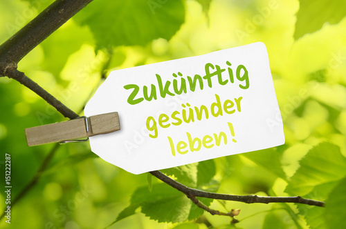 Zukünftig gesünder leben! - Label in grüner Natur photo